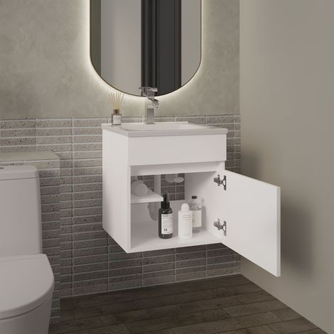 Belle meuble de salle de bain suspendu avec lavabo et une porte (1/5)