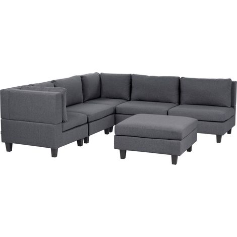 Divano componibile a 5 posti imbottito lato destro in tessuto grigio scuro con gambe nere e pouf Unstad