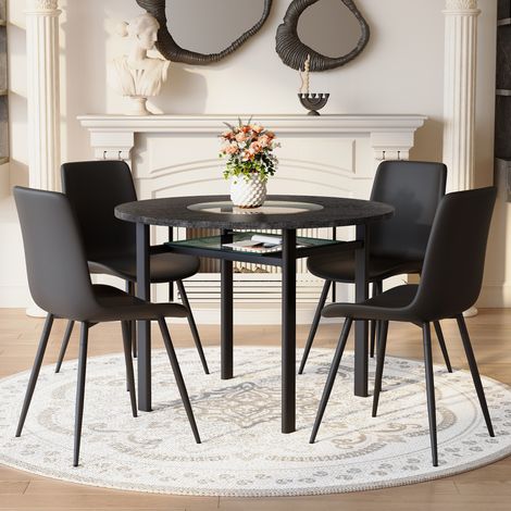 Ensemble salon moderne table ronde 100cm aspect bois foncé, 4 fauteuils polyuréthane noir avec coussins élargis confortables, idéal pour séjour ou espace détente. (1/5)