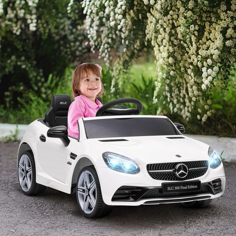 Voiture électrique pour enfants, avec phares LED, ceinture de sécurité, klaxon, musique, vitesse de 3 à 5 km/h, blanche, 107 x 62,5 x 44 cm