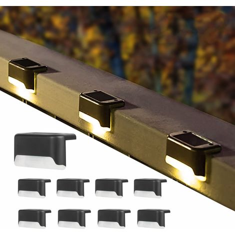 Lámpara solar de jardín para iluminar escaleras, vallas y barandillas. Aplique LED decorativo para exteriores, ideal para patios o jardines, con carcasa transparente y luz cálida. (1/5)