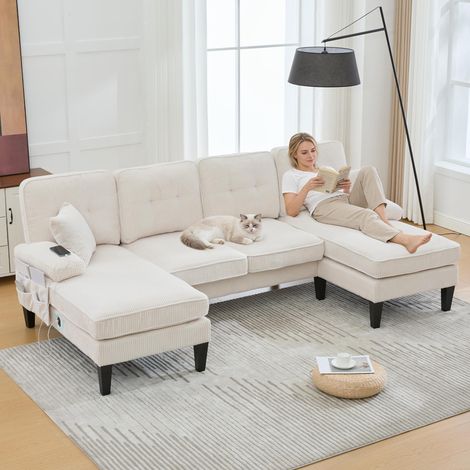 Canapé d'angle moderne 4 places en U beige, velours côtelé doux, double méridienne. Rembourrage confortable, dossier design et structure robuste. Idéal pour tous les styles de salon.