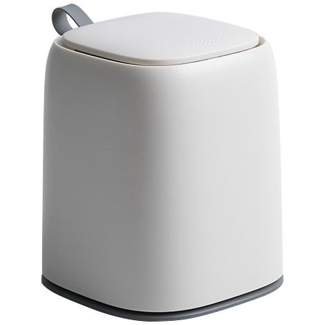 Poubelle de bureau à pression avec couvercle, plastique blanc, étanche aux odeurs, poignée silicone, design compact pour table (1/5)