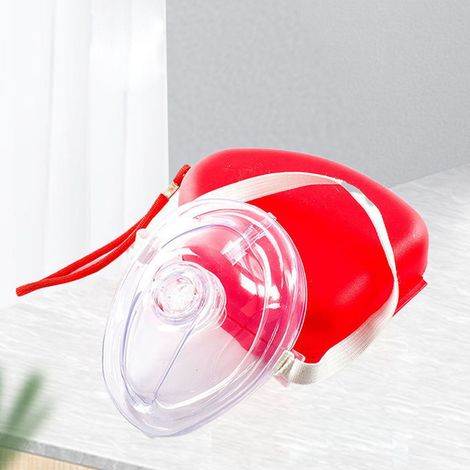 Erste-Hilfe-Schulung und -Unterweisung: Herz-Lungen-Wiederbelebung, Beatmungsmaske mit Einwegventil, künstliche Beatmungsmaske, Mund-zu-Mund-Beatmung nach den Richtlinien des Roten Kreuzes. (1/5)