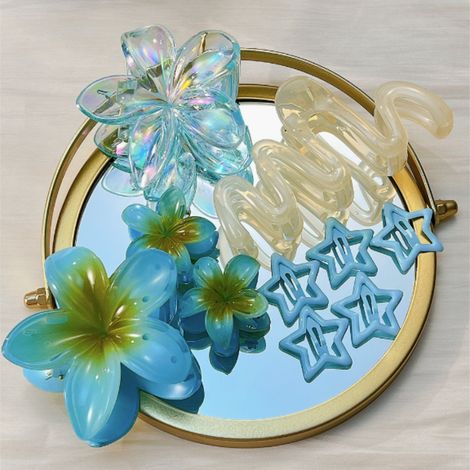 barrette à cheveux bleue en forme d'œuf avec fleur