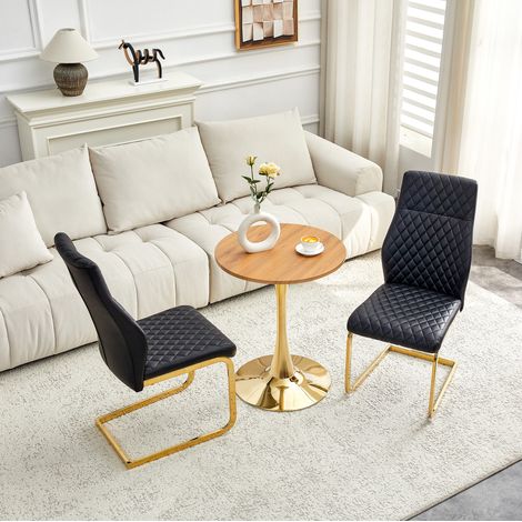 Conjunto de comedor con mesa redonda MDF efecto madera 60x72 cm y 2 sillas de PU negro con patas metálicas doradas (1/5)