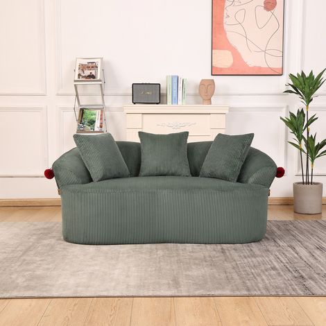 Canapé deux places arqué en velours côtelé orné d'un motif de chapeau de clown. Coussins et tapis pour animaux inclus, pour une ambiance chaleureuse et confortable. (1/5)