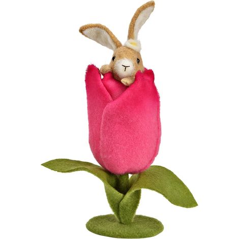 Décoration un lapin en feutre dans une fleur de jardin