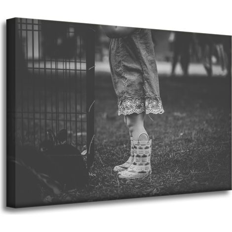 Leinwanddruck: Schwarze und weiße Gummistiefel, 70 x 50 cm