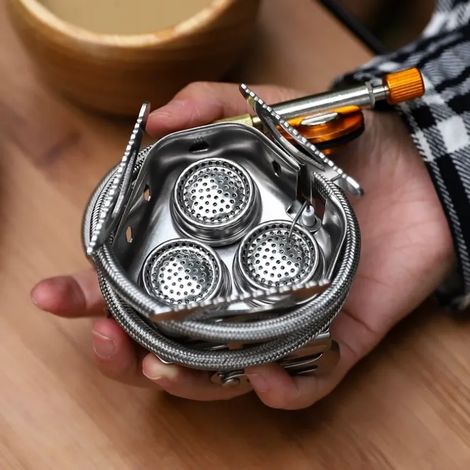 Réchaud à gaz pliable et portable pour le camping, avec allumage électronique haute puissance, idéal pour les pique-niques en extérieur. (1/4)