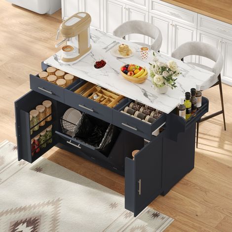 Isla de cocina móvil con encimera abatible, carrito de cocina con ruedas, 3 cajones grandes, 2 estantes con puertas y un cubo de basura, 136 × 50 (75) × 92 cm (1/5)