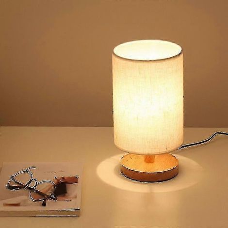 Lampe de chevet ronde avec abat-jour en tissu et base en bois massif, idéale pour la chambre et le salon.