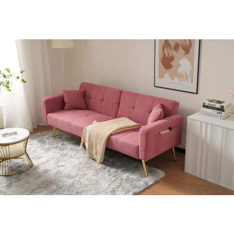 Canapé-lit convertible : doté de pieds dorés, il est accompagné de coussins décoratifs et d'une poche de rangement latérale.