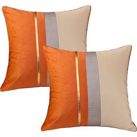 Housse de coussin patchwork bleu marine avec taie d'oreiller à rayures dorées, style moderne et luxueux (1/5)