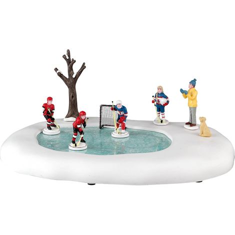 Figura de niñas jugando hockey para aldea navideña