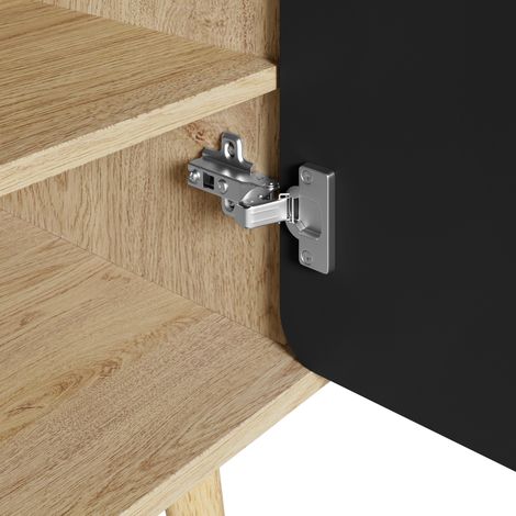 Armoire à chaussures moderne, avec des portes arrondies et géométriques. Elle offre plusieurs compartiments pour ranger les chaussures. Les pieds en bois rendent l’armoire stable.