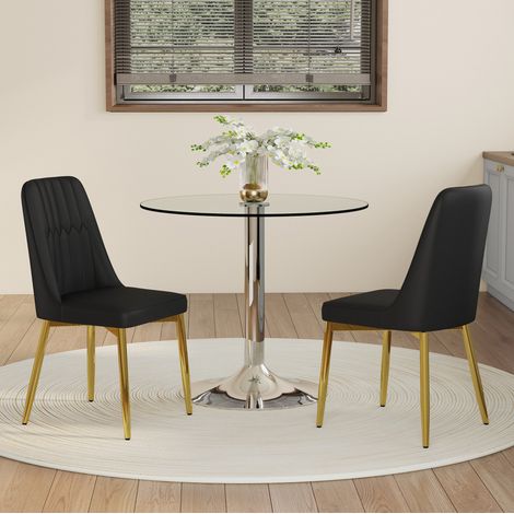 Conjunto de comedor con mesa redonda de vidrio 85x76 cm y 2 sillas de PU negro con patas metálicas doradas (1/5)