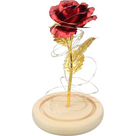 Des roses sous verre, symboles de chance, de beauté et de romantisme, illuminées par des LED, constituent un cadeau idéal pour la Saint-Valentin. Roses rouges recouvertes de feuille d'or. (1/5)