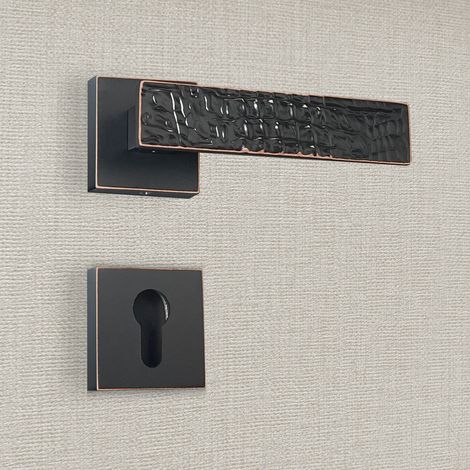 Poignée de porte design à cylindre finition aspect cuir patiné noir Perla - KATCHMEE (1/4)