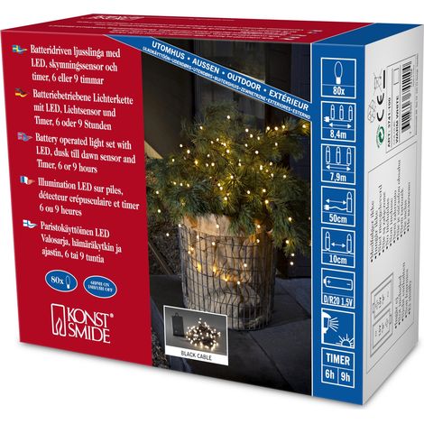 Konstsmide 3741-100 - Catena luminosa LED, diodi rotondi, con interruttore on/off e sensore luminoso, timer per 6 e 9 ore, adatta a esterni (IP44), 80 diodi a luce bianca calda, funzionamento a batter (1/3)