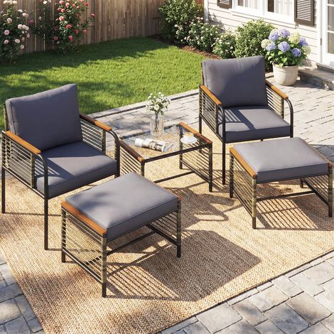 Salon de Jardin 4 Pièces en Rotin PE Gris, 2 Fauteuils avec Coussins, Tabouret Repose-Pieds et Table Basse Verre Trempé, Structure Métallique Résistante pour Balcon Terrasse Extérieur (1/5)