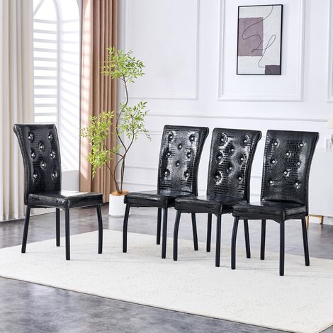 Un ensemble de 4 chaises de salle à manger vintage noires, recouvertes de cuir façon - qualité supérieure et confort optimal (1/5)