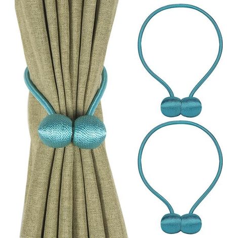 Un set di due fermatende magnetici con ganci a sfera per fissare le scollature delle tende e i passanti del cordino. (1/5)