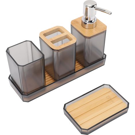 Ensemble d'accessoires de salle de bain comprenant un porte-brosse à dents, un gobelet, des flacons de lotion, un porte-savon et un plateau gris. (1/5)