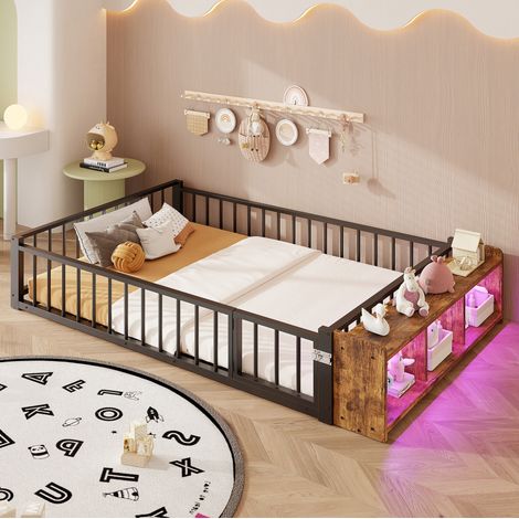 Cama infantil 140x200 cm negra de metal y MDF con barandilla, almacenamiento abierto y LED (1/5)
