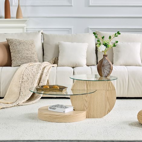 Table basse minimaliste moderne à deux niveaux en verre de sécurité, design multicouche, avec une structure de support en MDF de haute qualité et une finition bois clair. Disponible en plusieurs color (1/4)