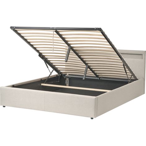 Cama con almacenaje somier de láminas tapizado de tela 160 x 200 cm luces LED multicolores beige Armelle