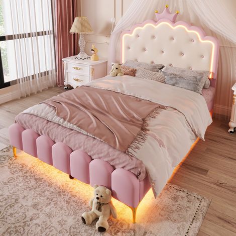 Letto imbottito principessa 140x200 cm in PU rosa con testiera a corona, rete a doghe e LED d’atmosfera (1/5)