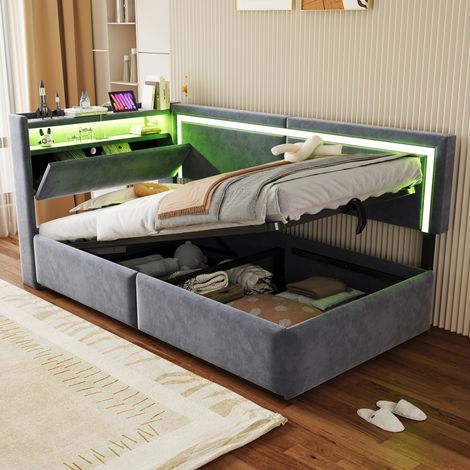 Divano letto imbottito 90x200 cm con illuminazione a LED e porte di ricarica USB. La testiera si apre per fungere da contenitore. Sistema di contenimento idraulico sotto il letto, tessuto in velluto g