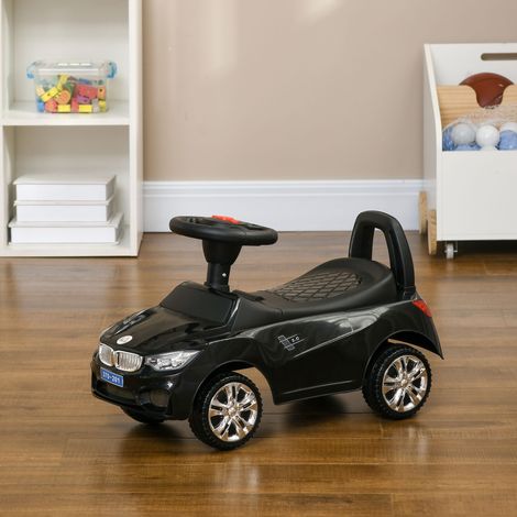 Voiture électrique pour enfant, véhicule à pousser avec coffre à jouets, klaxon, phares et musique, 63,5 x 28 x 36 cm, noire (1/5)