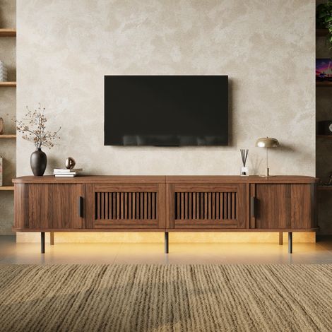 Meuble TV bas 180x40x44,5 cm avec éclairage LED, portes coulissantes, tiroirs et façade rainurée, bords arrondis, MDF, effet noyer (1/5)