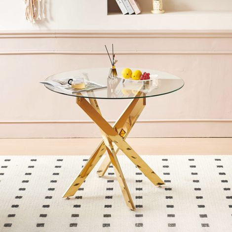 Table à manger ronde en verre et métal doré, piétement croisé, facile d’entretien (1/5)