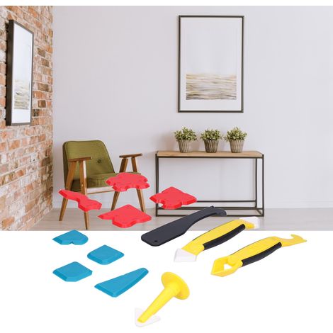 Outils pour l'application de mastic sur les sols, les portes et les fenêtres : grattoir à mastic silicone, buse à mastic, pistolet à calfeutrer, grattoir et dissolvant d'adhésif. (1/5)