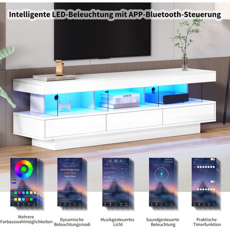 Armoire de télévision en acier blanc, avec une finition haut de gamme. Elle est équipée de 3 compartiments en verre. La lumière est assurée par des LED. L’armoire est contrôlée via l’application mobil (1/5)