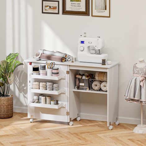 Table de couture pliante avec plateau dépliable, boîtes de rangement, étagère ouverte et roulettes, blanche