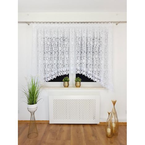 Cortina confeccionada con una marquesina de 400x160 cm sobre una cinta fruncidora con encaje guipur y estampado floral. (1/5)