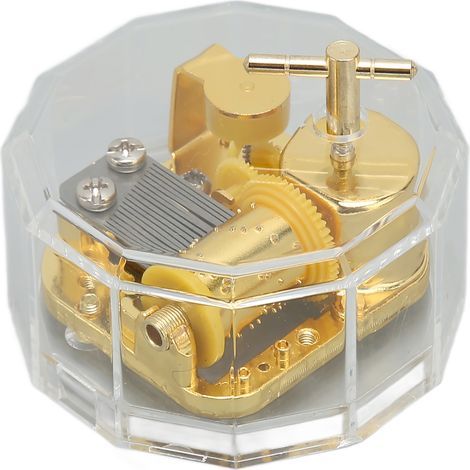 Goldene, durchsichtige Acryl-Spieluhr in Polygonform, ideal für Dekoration und Bastelarbeiten. (1/5)