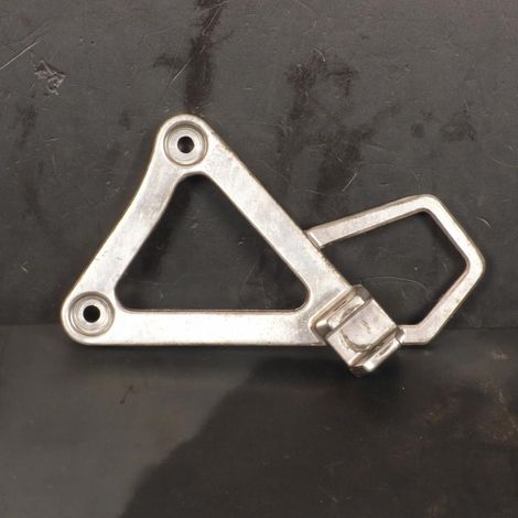 [PRODUIT D'OCCASION] Platine de repose pied pilote gauche origine pour moto Honda 125 (1/2)