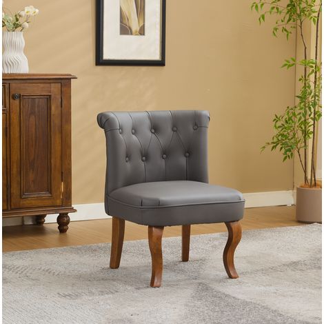 Sedia da pranzo in pelle grigia con gambe in legno, bottoni decorativi e seduta confortevole (1/5)