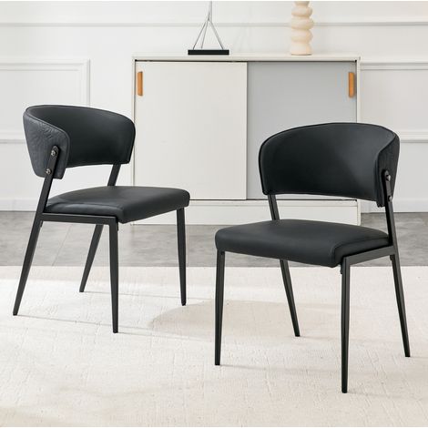 Set de 2 sillas de comedor acolchadas de polipiel negra con patas metálicas ergonómicas (1/5)