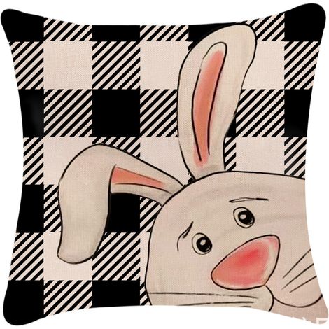 Funda de almohada decorativa de Pascua con un conejito a cuadros.