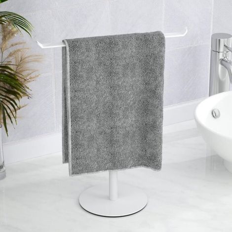White towel rack with a round base, 27 cm wide and 30 cm high, designed for storage on the bathroom countertop. (1/5)