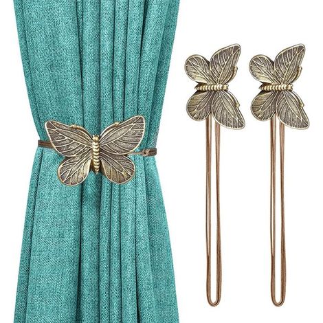 Confezione da 2 fermatende magnetici vintage a forma di farfalla in resina color bronzo. (1/5)