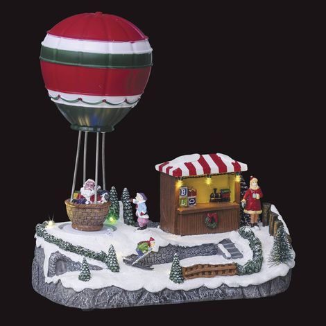Fééric Lights And Christmas – Village de Noël lumineux animé – Manège montgolfière avec 9 LED multicolores – Décor intérieur 22.5cm – Poids 0.7kg (1/4)