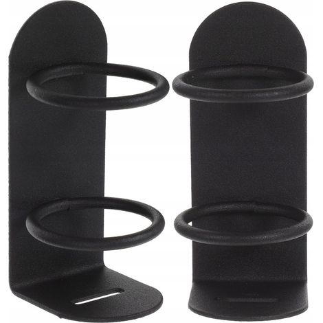 Zwei schwarze, an der Wand befestigte Zahnbürstenhalter aus Eisen.