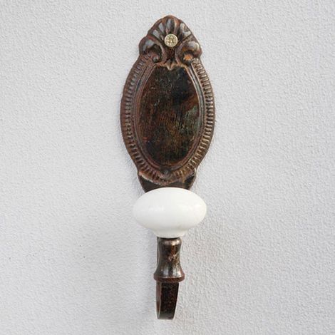 Patère camée en fonte marron – Plaque dorsale ovale en relief – Bouton en céramique blanche – Dimensions 15x4x5cm – Chehoma (1/3)